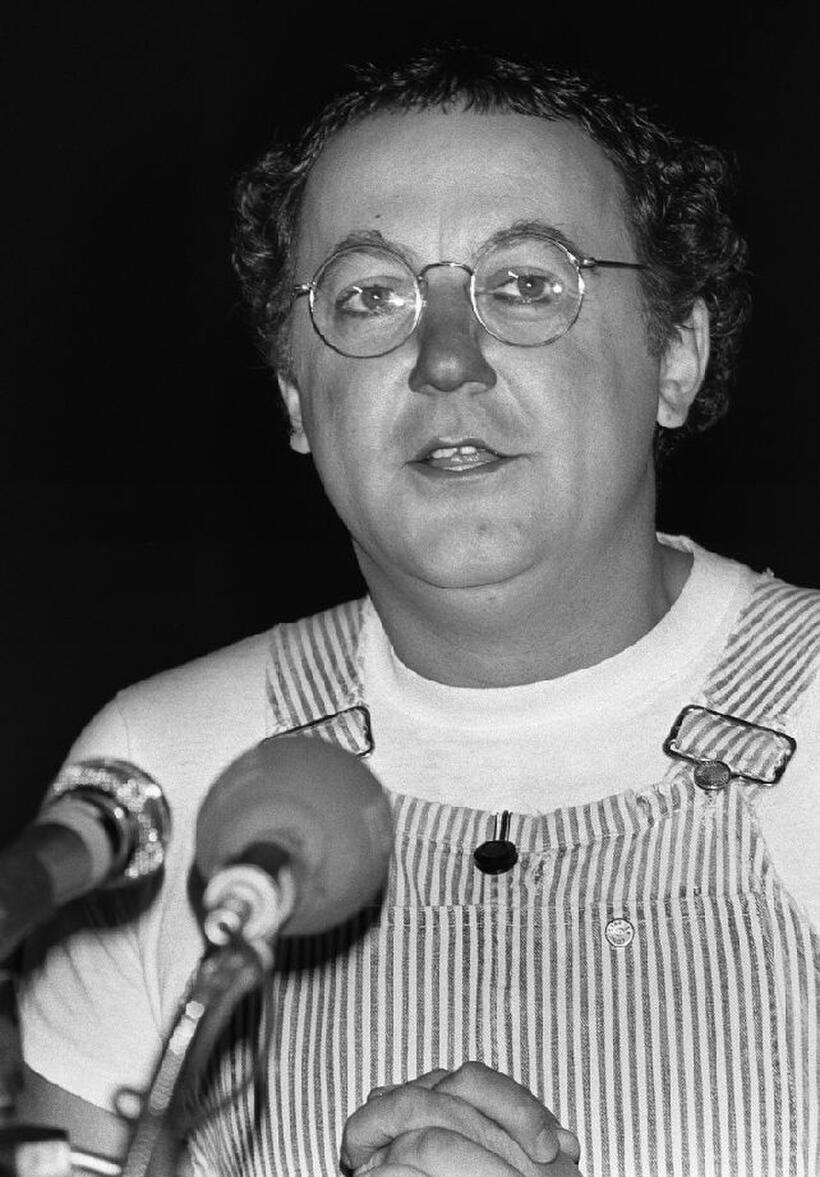 The comedien Coluche gives a conference of press in Paris.