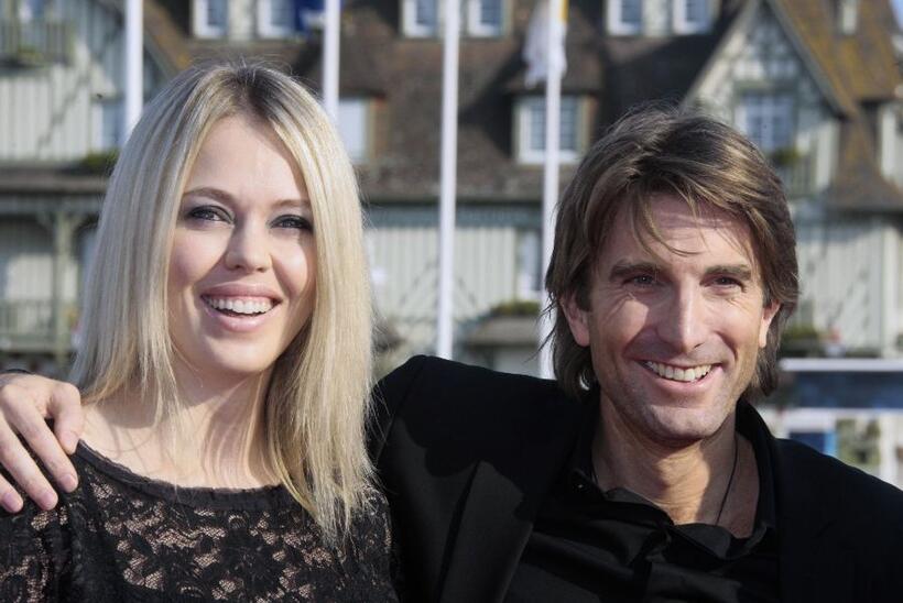 Sharlto Copley and Guest at the screening of "District 9" during the 35th American Film Festival.