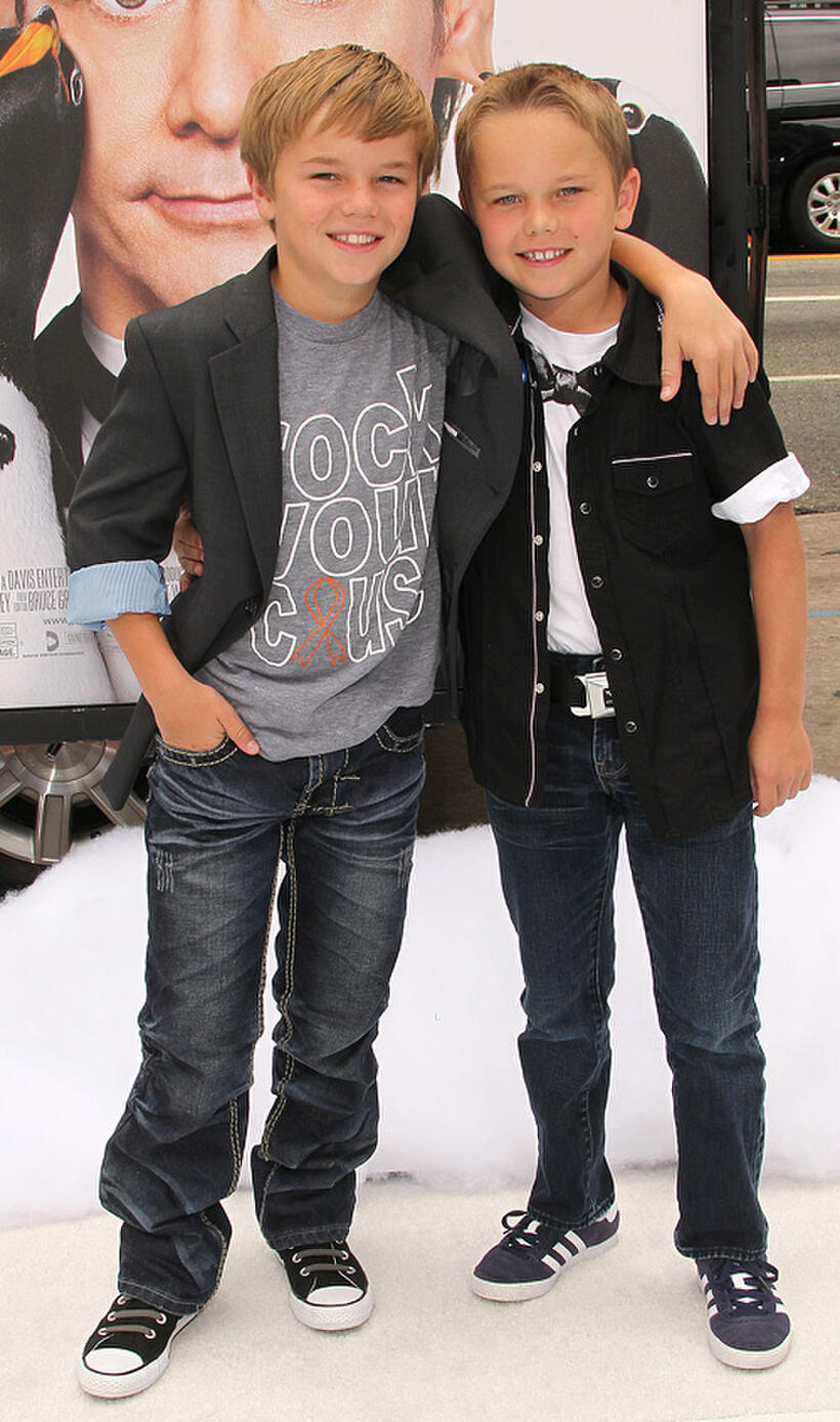 Maxwell Perry Cotton and Guest at the premiere of "Mr. Popper's Penguins."