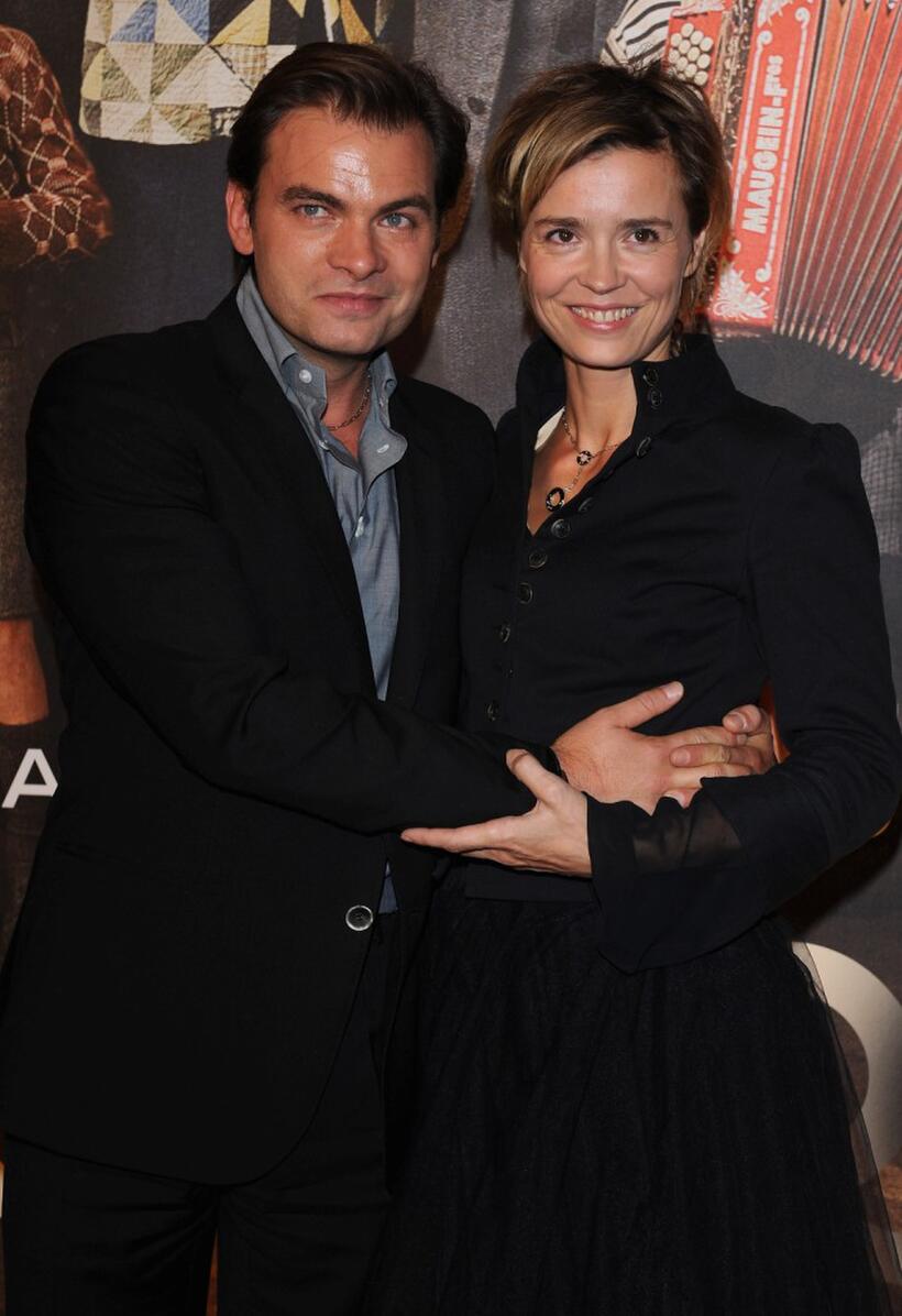 Clovis Cornillac and Caroline Proust at the premiere of "Faubourg 36."