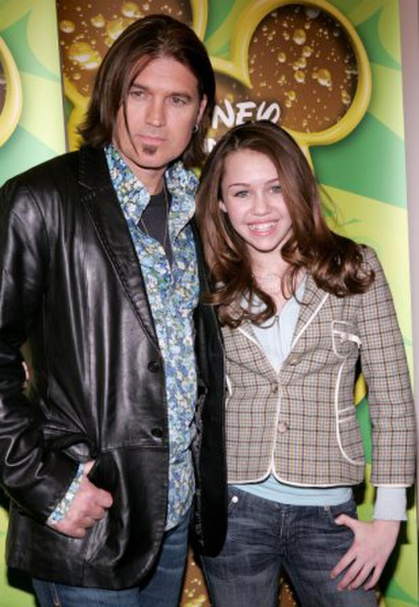 Billy Ray Cyrus and daughter Miley Cyrus poses as Stars of the Disney Channel at the Splashlight Studios.