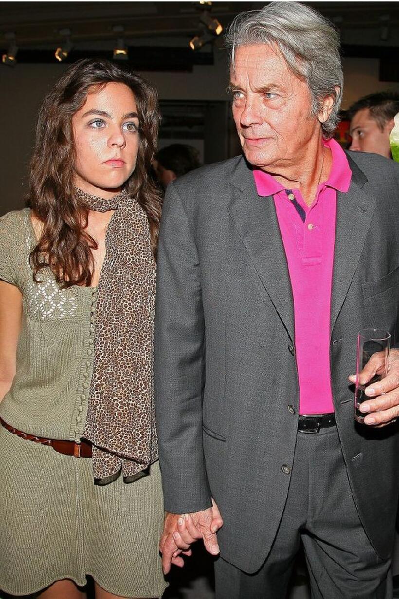 Alain Delon and his daughter Anouchka Delon at the pre-launch cocktail party for his upcoming auction of paintings.