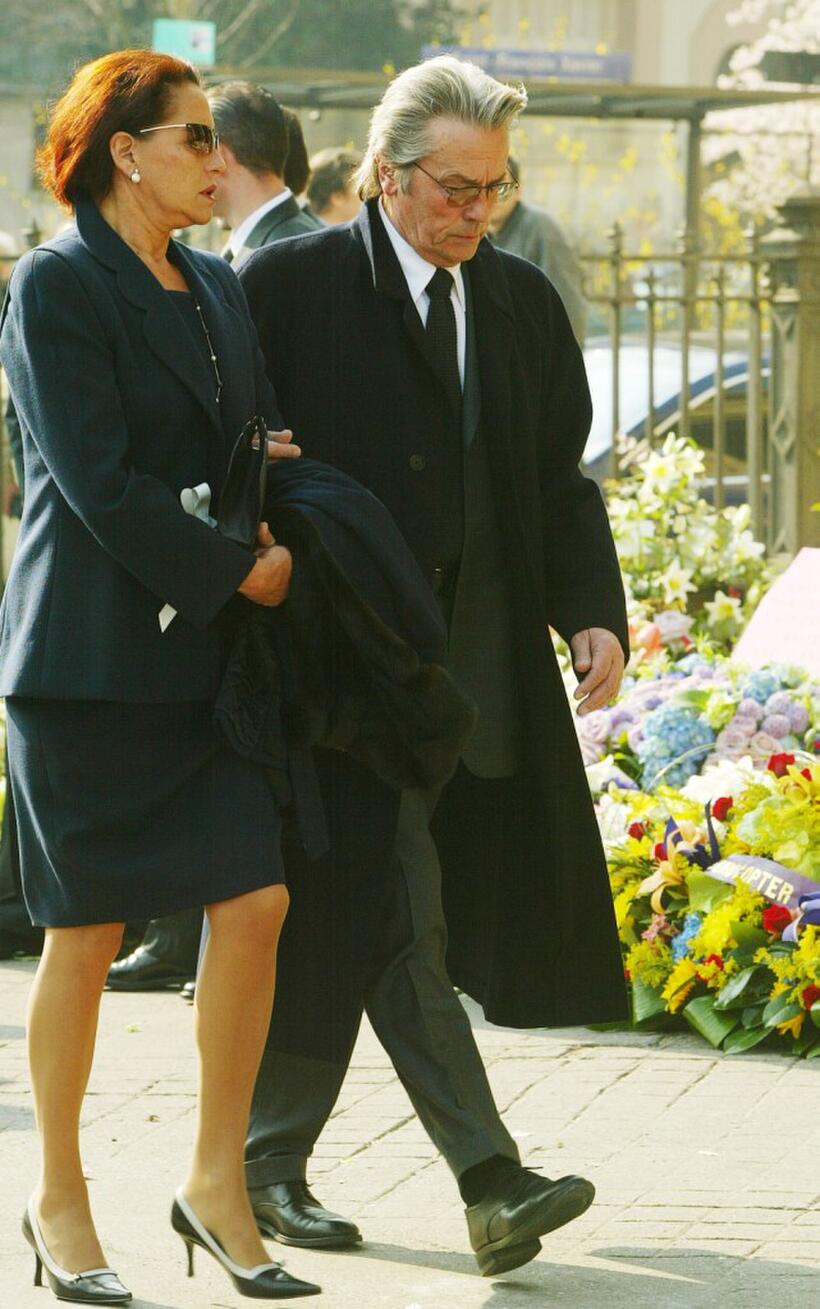 Alain Delon and a friend at the Saint Francois Xavier church to attend Jean-Luc Lagardere's funeral.