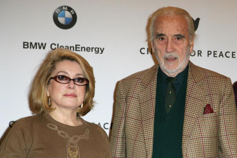 Catherine Deneuve and Christopher Lee at the photocall of "Cinema For Peace" during the 58th Berlinale Film Festival.
