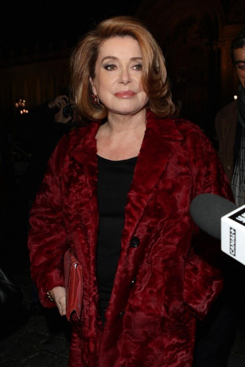 Catherine Deneuve at the Yves Saint Laurent show during the Paris Fashion Week.