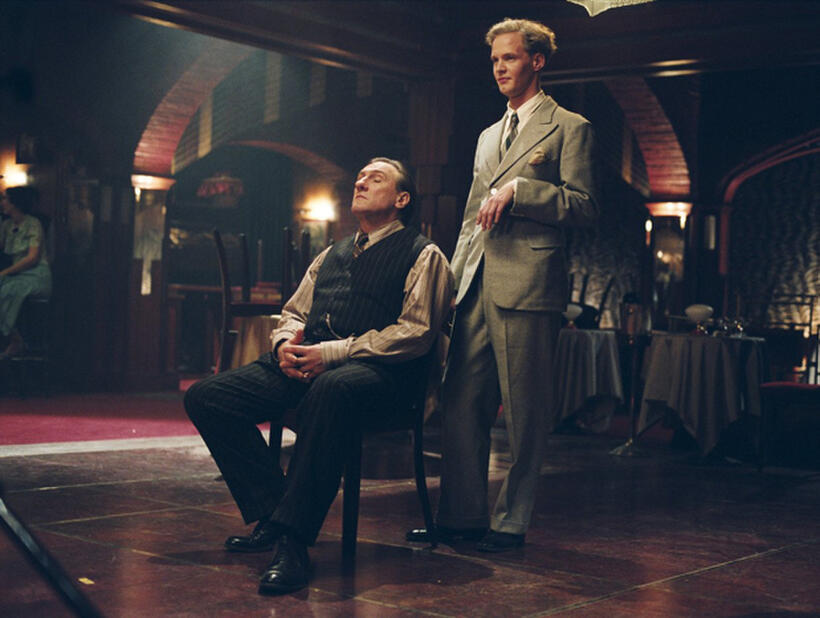 Louis Leplee (Gerard Depardieu) and his assistant (Ashley Wanninger) "La Vie en Rose."