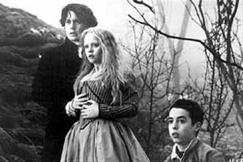 Johnny Depp as Ichabod Crane, Christina Ricci as Katrina Van Tassel and Marc Pickering as Young Masbeth in ``Sleepy Hollow.''