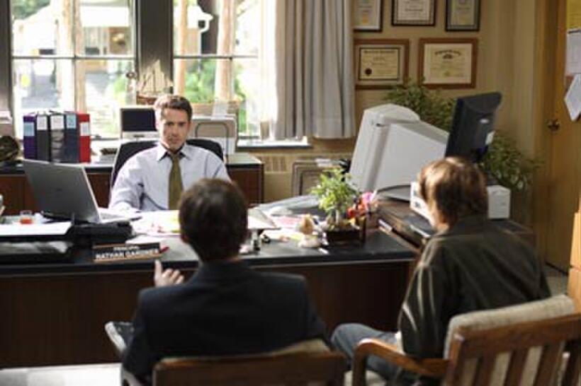 Principal Gardner (Robert Downey Jr.) listens to two students in "Charlie Bartlett."
