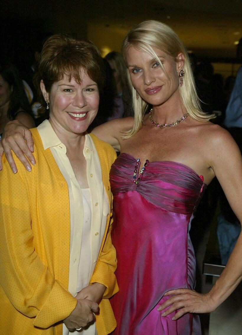 Christine Estabrook and Nicollette Sheridan mingle at the Desperate Housewives premiere party.