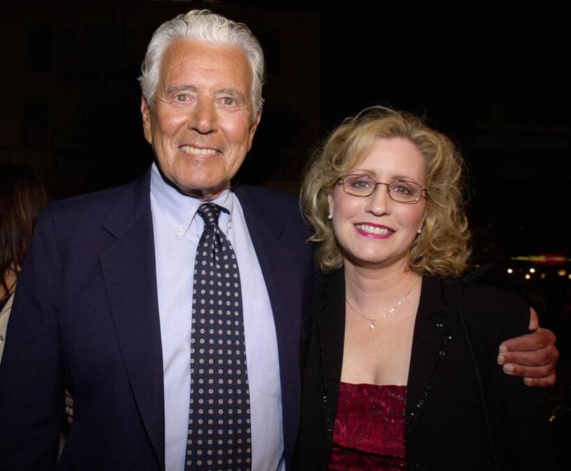John Forsythe and date at the premiere of "Charlie's Angels".