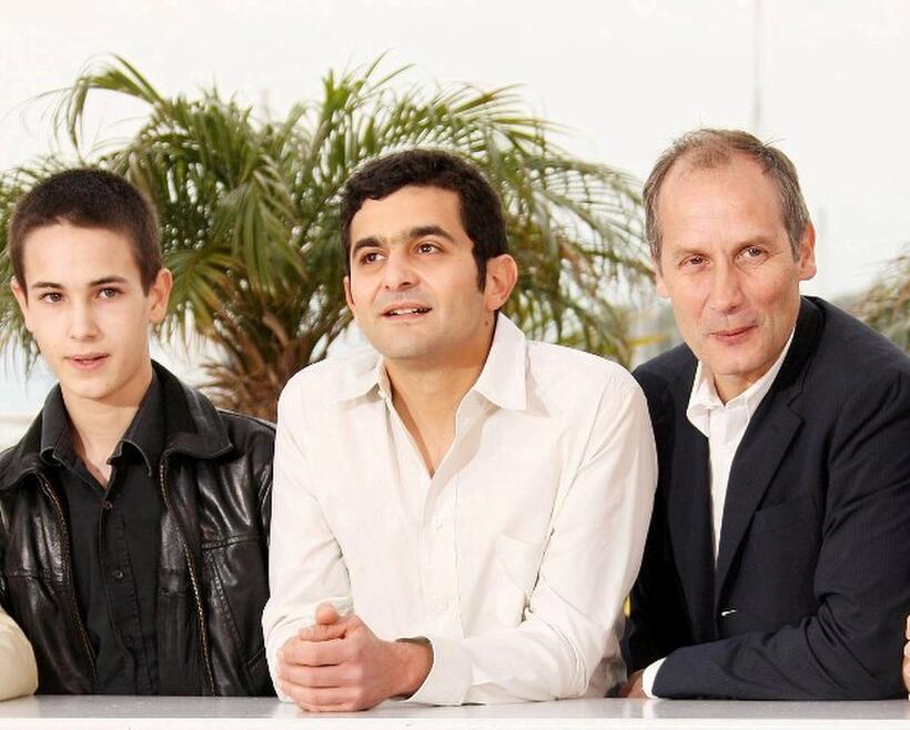 Emile Berling, Laurent Capelluto and Hippolyte Girardot at the photocall of "Un Conte De Noel" during the 61st Cannes International Film Festival.
