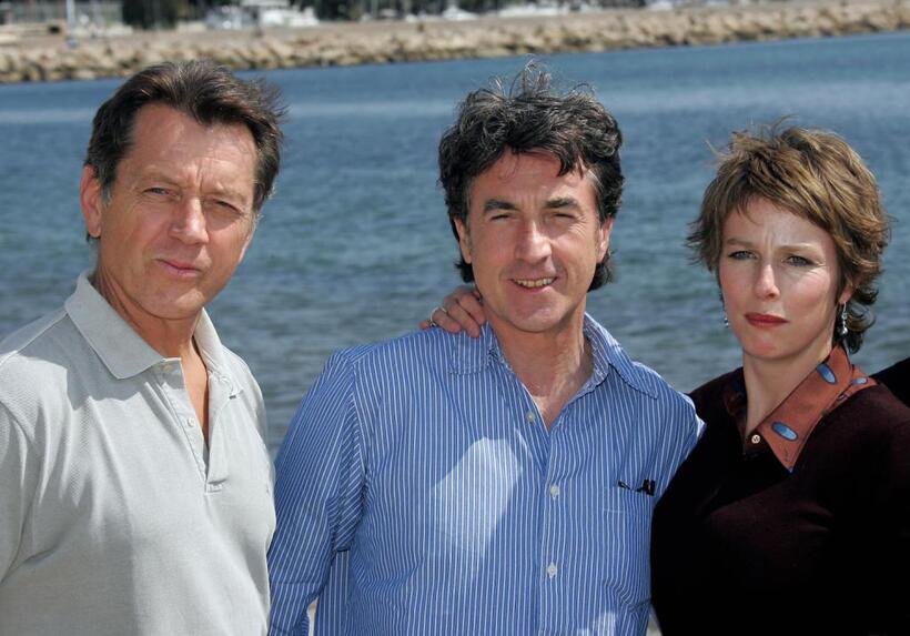 Bernard Giraudeau, Karin Viard and Francois Cluzet at the photo call of "Je Suis un Assasin" at the 57th Cannes Film Festival.