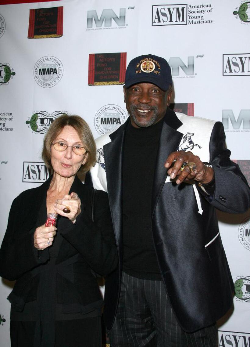 Louis Gossett, Jr. and Guest at the Holiday Toy Drive Fundraising Extravaganza.