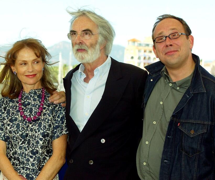 Isabelle Huppert, director Michael Haneke and Olivier Gourmet at the photocall of "Le Temps du loup" during the 56th International Cannes Film Festival.