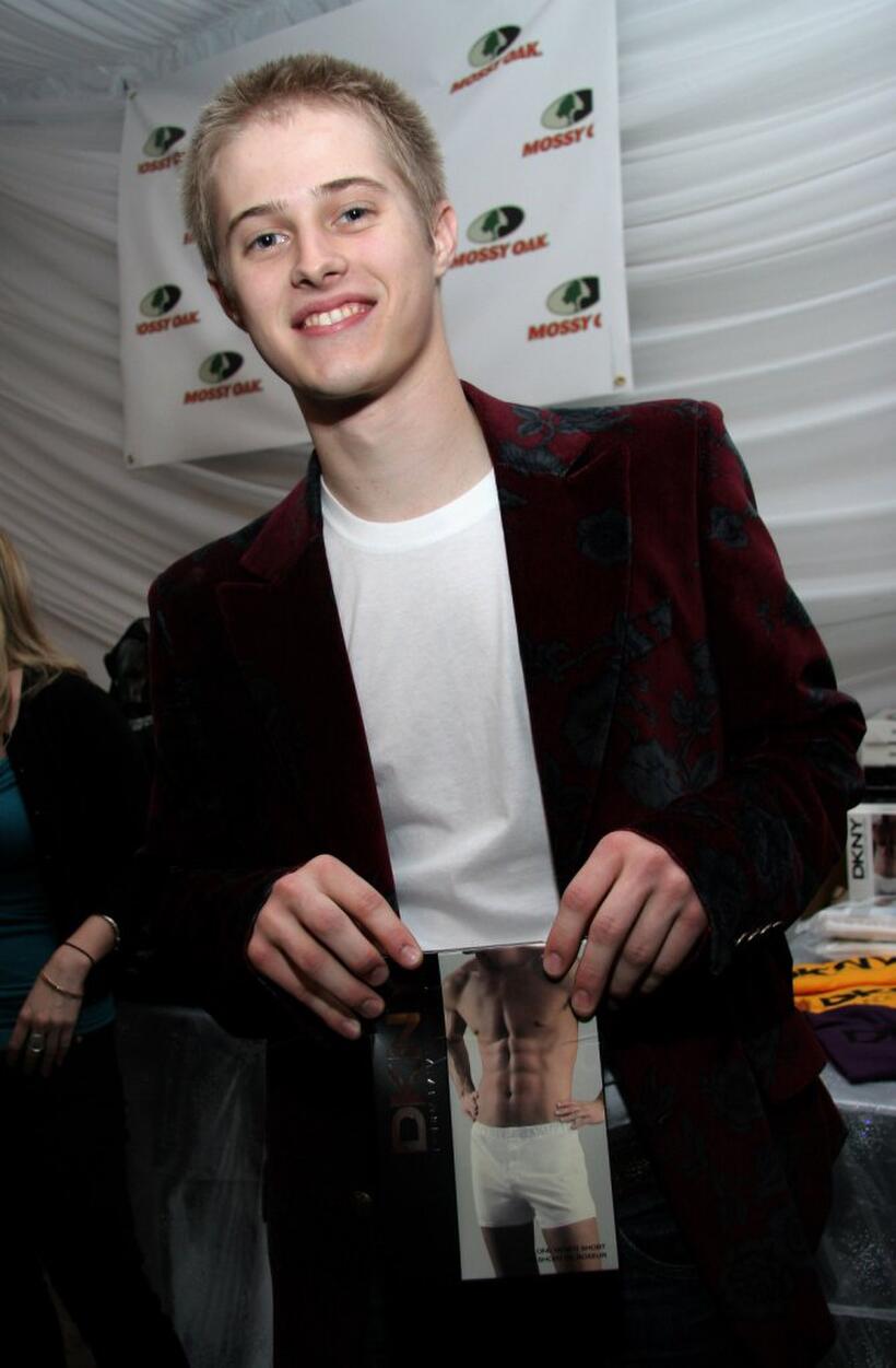 Lucas Grabeel at the American Music Awards with distinctive assets.