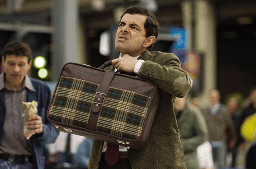 Mr. Bean (Rowan Atkinson), stuck in a familiar position, in "Mr. Bean's Holiday."