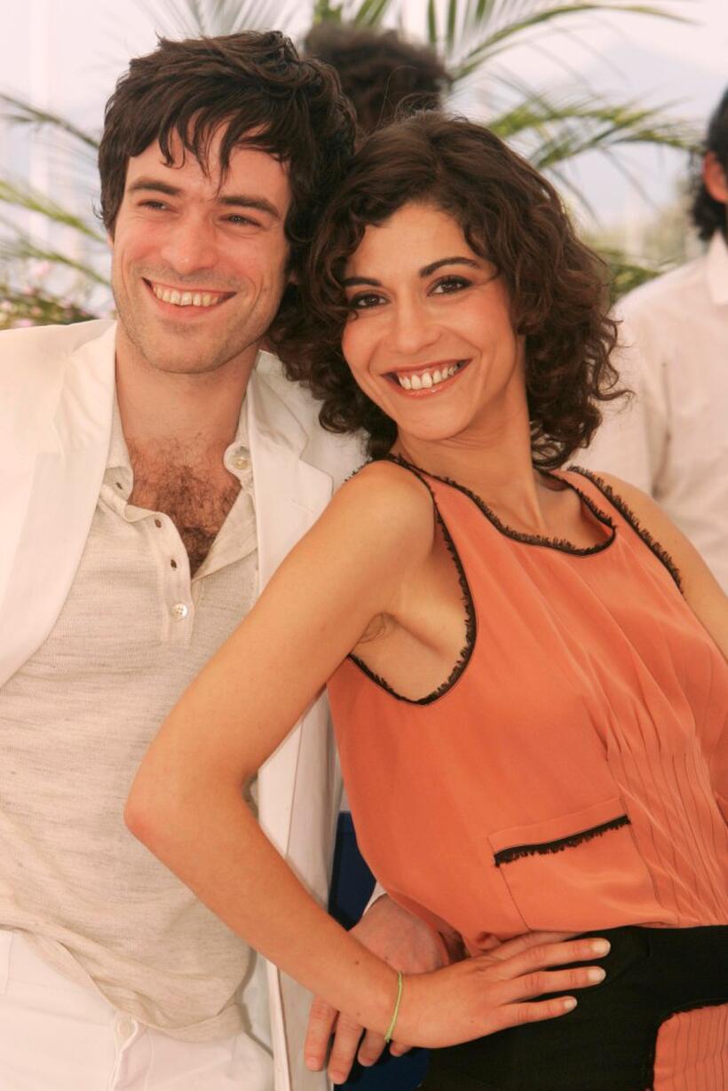 Romain Duris and Lubna Azabal at the photocall of "Exils" during the 57th Cannes Film Festival.