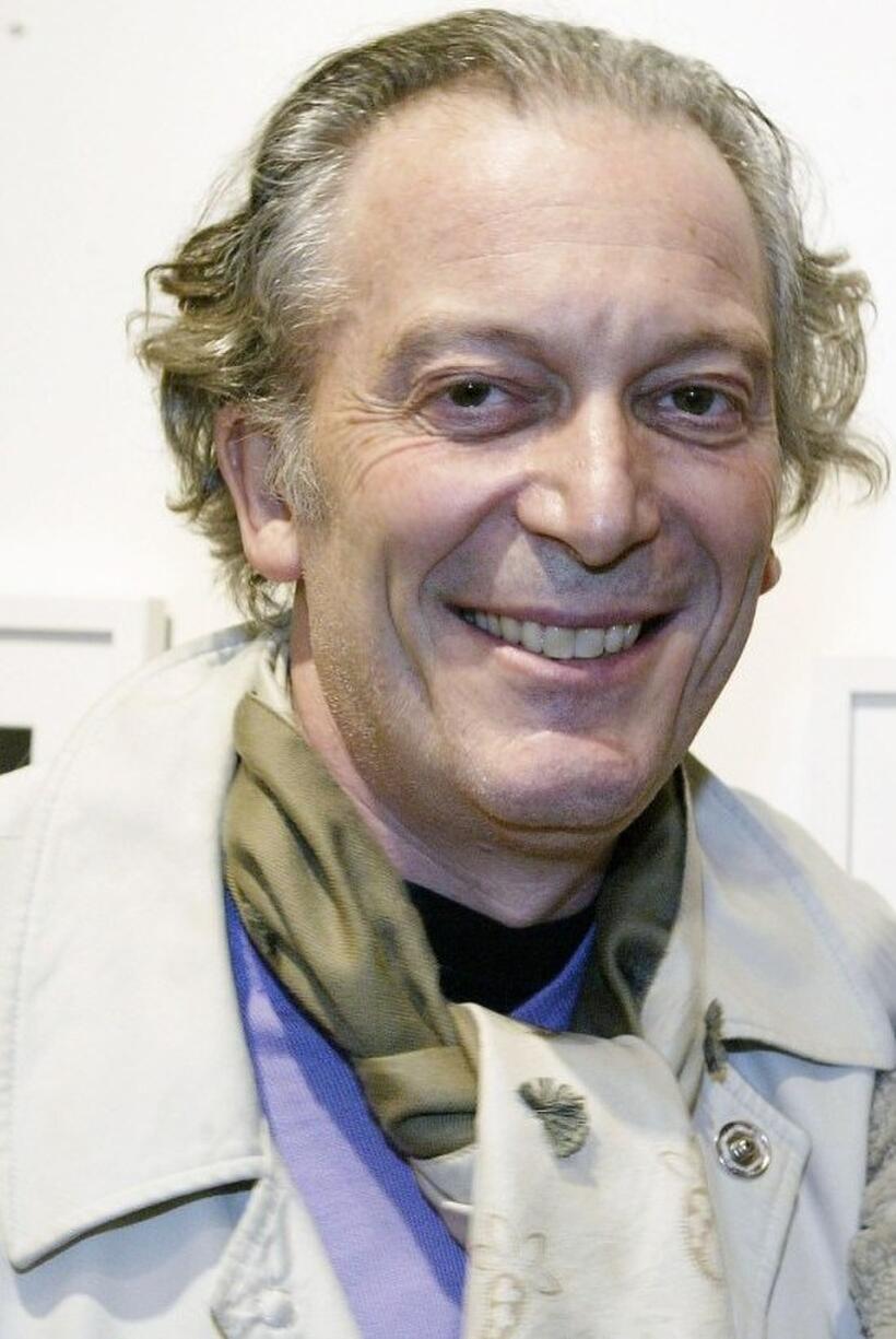 Ronald Guttman at the opening of photographer Patrick McMullan's gallery.