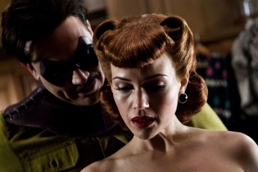 Jeffrey Dean Morgan as The Comedian and Carla Gugino as Silk Spectre in "Watchmen: The IMAX Experience."
