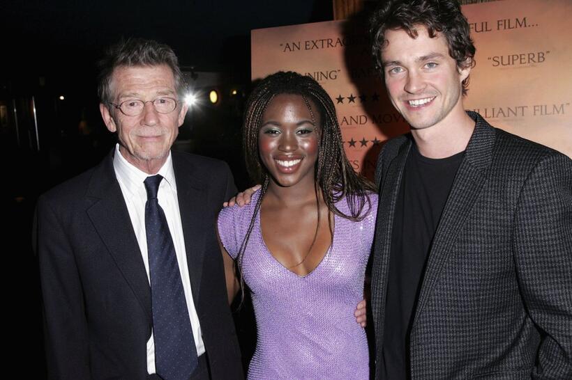 John Hurt, Claire-Hope Ashitey and Hugh Dancy at the UK premiere of "Shooting Dogs."