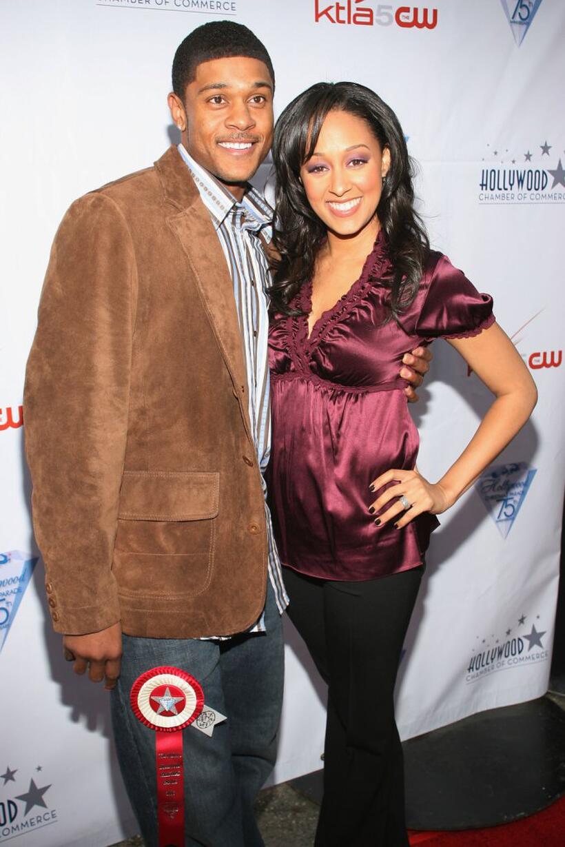 Pooch Hall and Tia Mowry at the 75th Annual Hollywood Christmas Parade.
