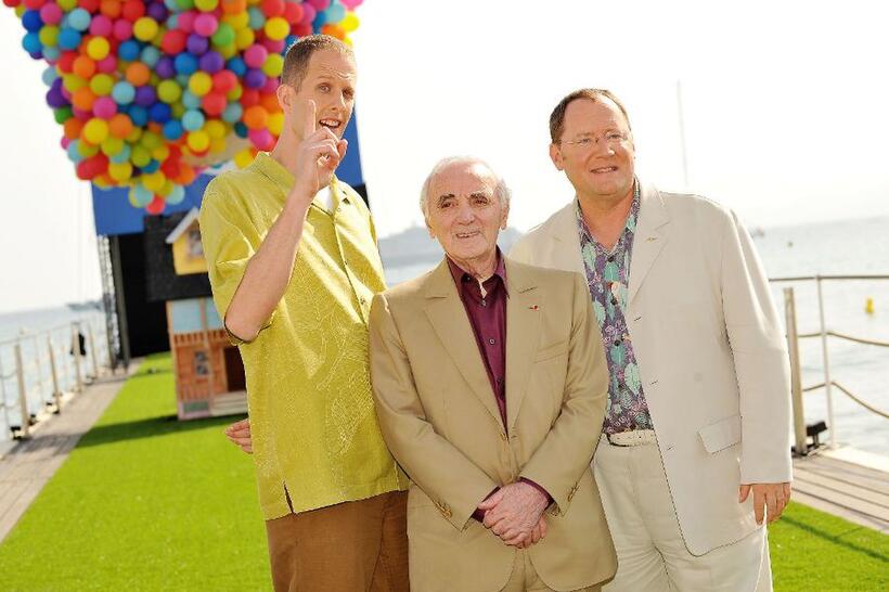 Director Pete Docter, Charles Aznavour and John Lasseter at the premiere of "Up" during the 62nd International Cannes Film Festival.
