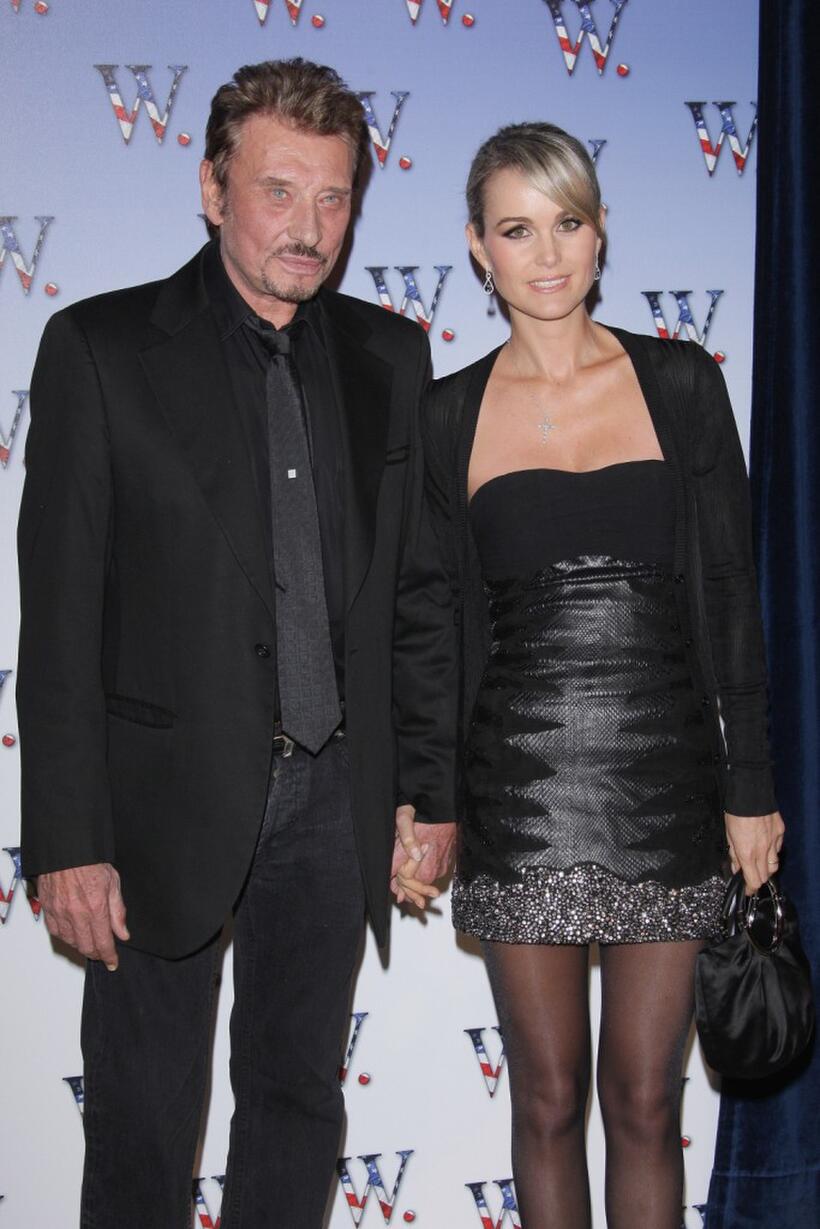 Johnny Hallyday and Laeticia Hallyday at the premiere of "W."