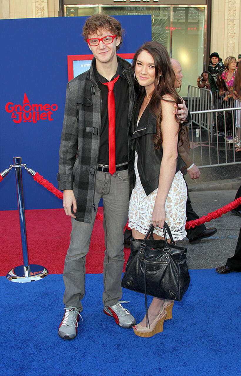 Nate Hartley and Guest at the California premiere of "Gnomeo and Juliet."