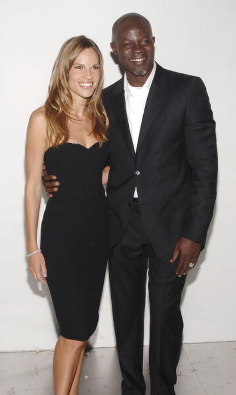 Djimon Hounsou and Hilary Swank at the 25th Anniversary Party of Calvin Klein Underwear.