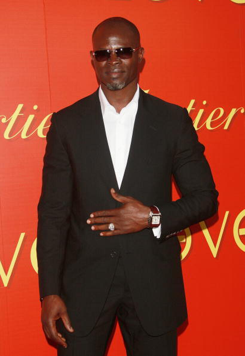 Djimon Hounsou attends a cocktail party in celebration of The Cartier Charity Love Bracelet.
