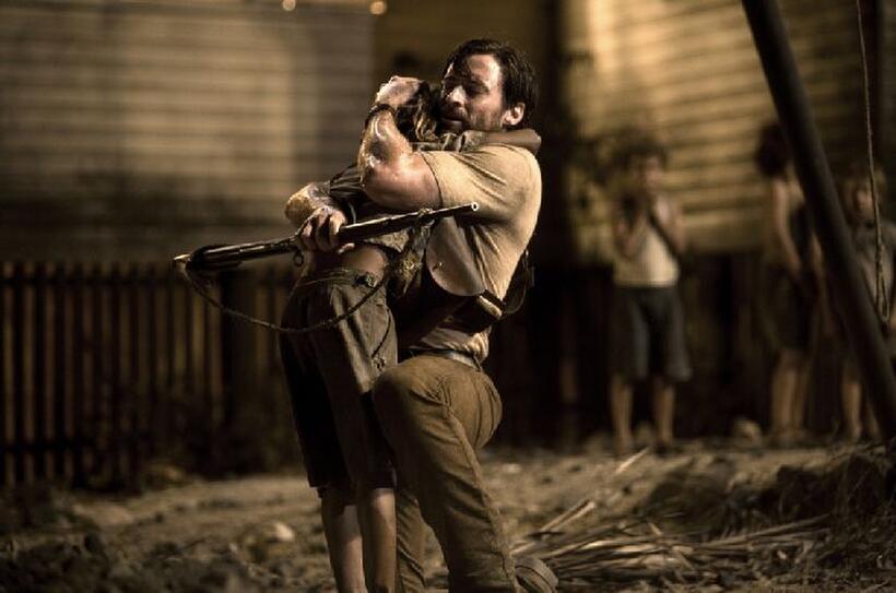 Hugh Jackman as The Drover and Brandon Walters as Nullah in "Australia."