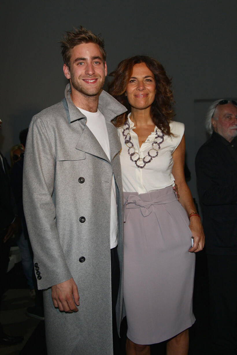 Oliver Jackson-Cohen and Roberta Armani at the Emporio Armani fashion show during the Milan Fashion Week Menswear Spring/Summer 2012 in Italy.