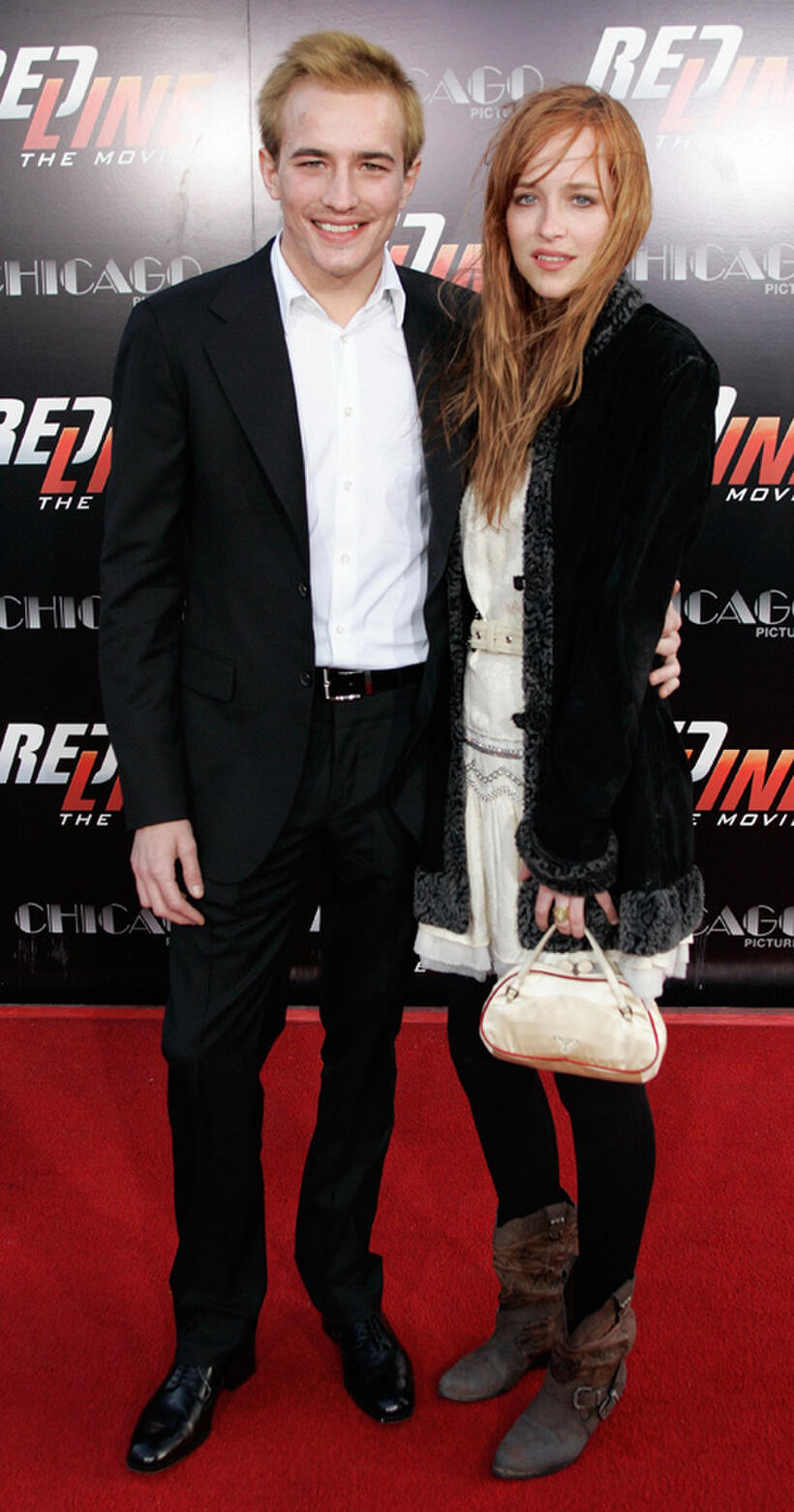Jesse Johnson and Dakota Johnson at the California premiere of "Redline."