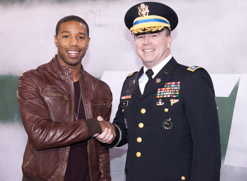Michael B. Jordan and Lt. Colonel Rich Davis at the Salute To The Tuskegee Airmen on Veteran's Day Weekend during the New York Jets Vs. New England Patriots Game in New Jersey.