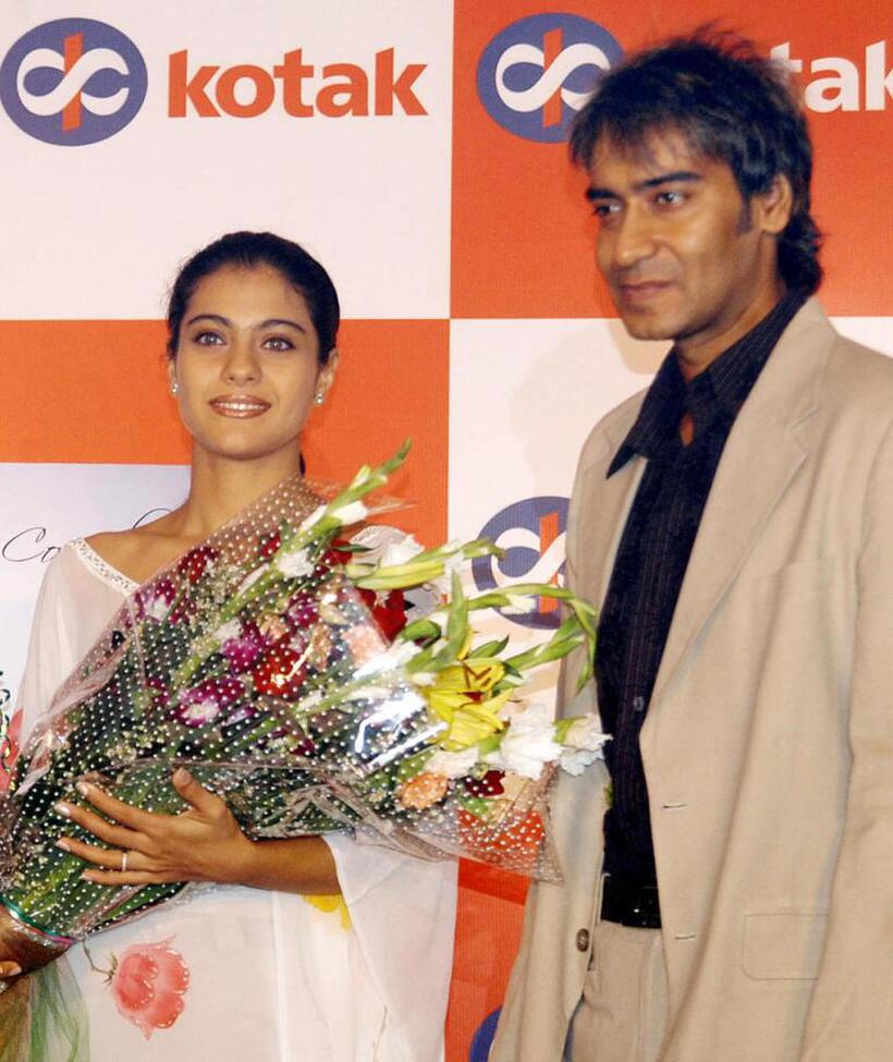 Kajol and Ajay Devgan at the launch of Kotak Mahindra "Best Compliments" card.