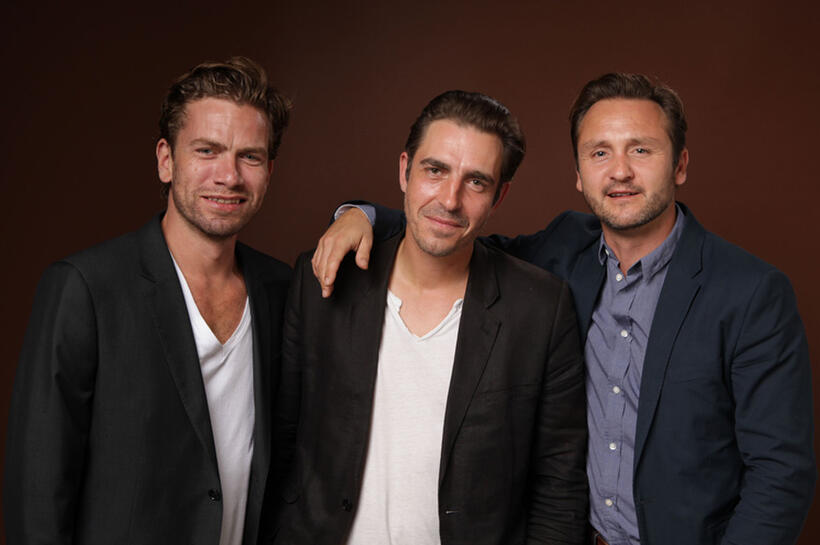 Nikolaj Lie Kaas, director Martin P. Zandvliet and Lars Ranthe at the portrait session of "A Funny Man" during the 2011 Toronto International Film Festival.