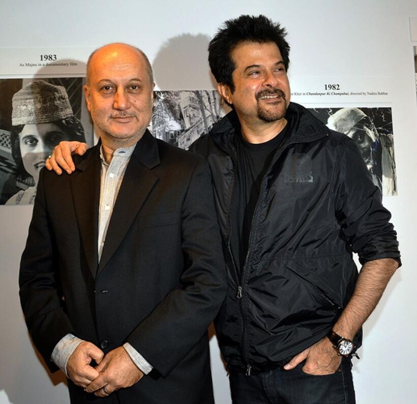 Anupam Kher and Anil Kapoor at the inauguration of artist Geeta Dass's exhibition of paintings.