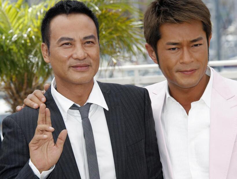 Louis Koo and Simon Yam at the photocall of "Triangle" during the 60th Cannes Film Festival.