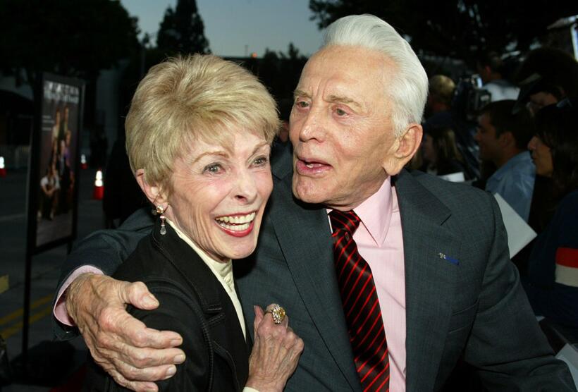 Janet Leigh and Kirk Douglas at the premiere of MGM's "It Runs in the Family".
