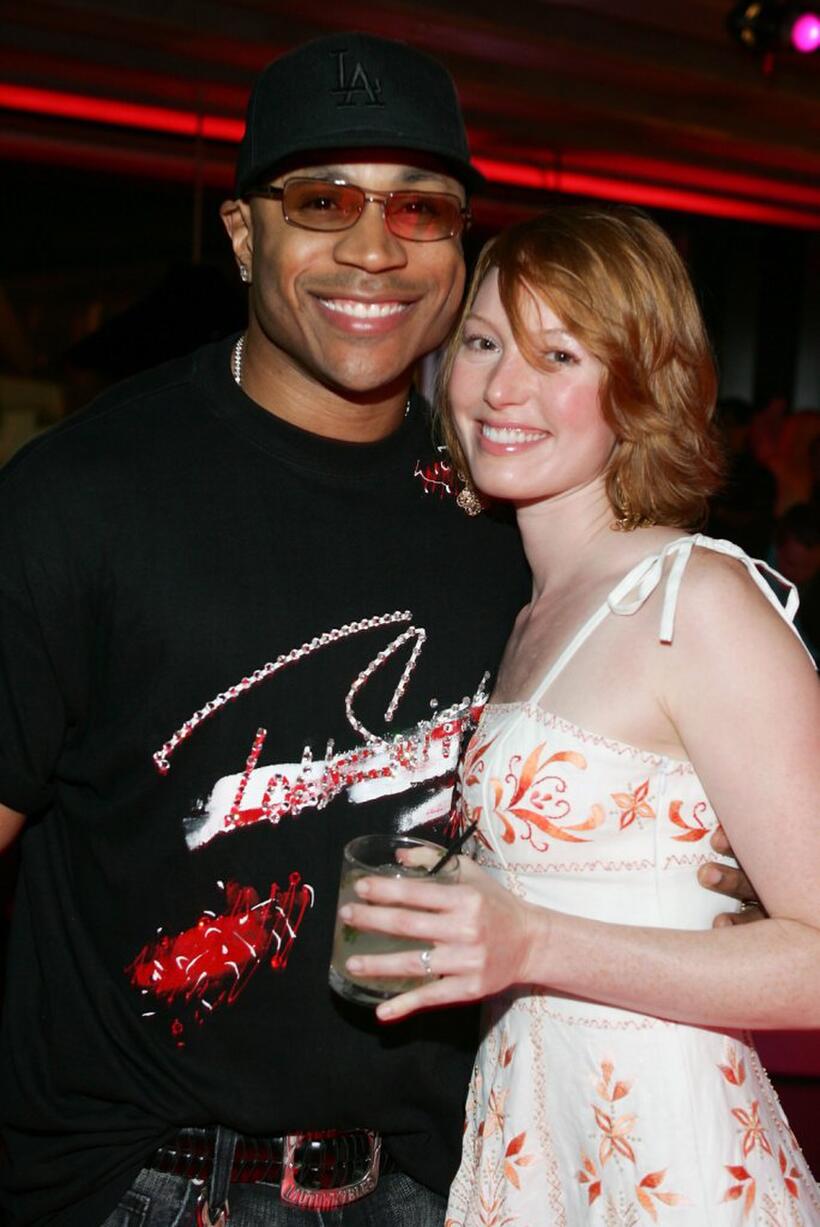 LL Cool J and Alicia Witt at the opening of "Waist Down - Skirts By Miuccia Prada."