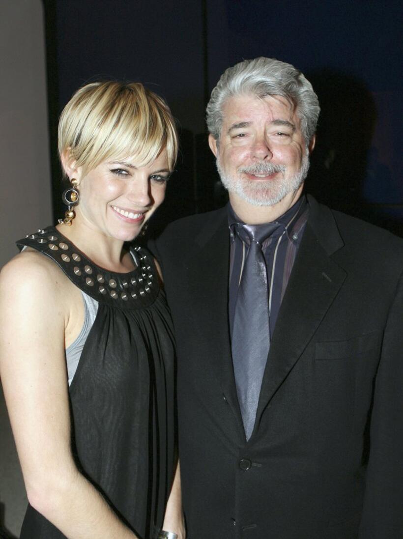 George Lucas and Sienna Miller at the Weinstein Co. Pre-Oscar Party.