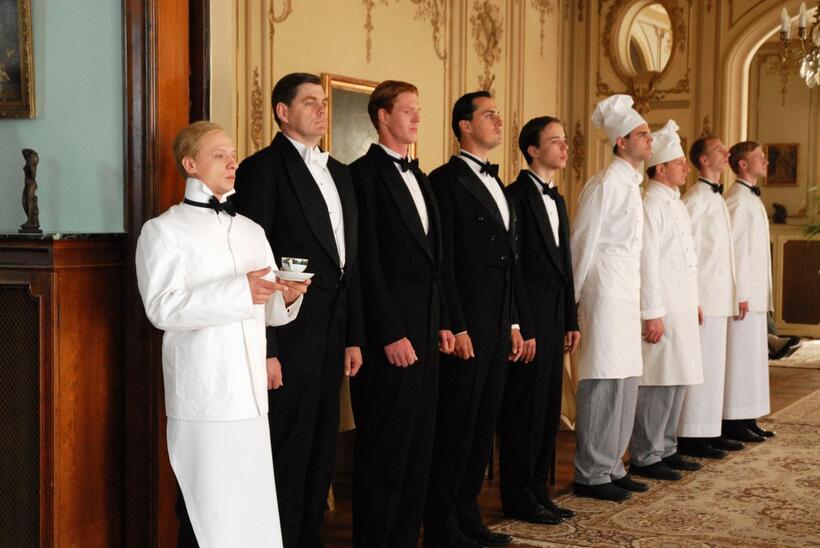 Ivan Barnev as Jan Díte with staff at the Hotel Tichota in "I Served the King of England."