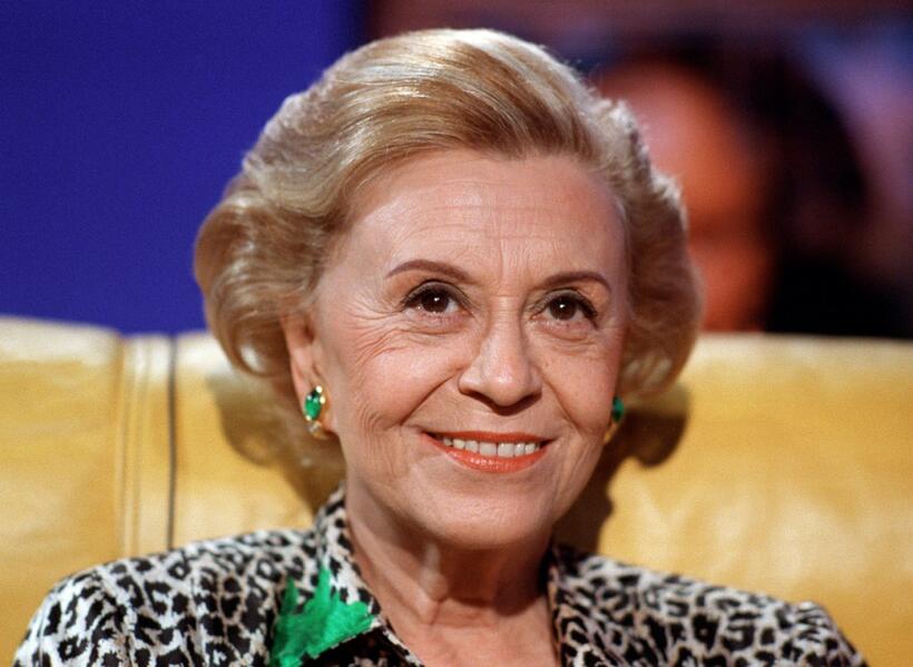 Italian actress Giulietta Masina smiles.