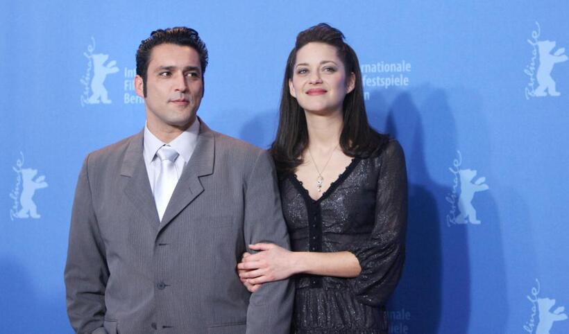 Jean-Pierre Martins and Marion Cotillard at the photocall of "La vie en rose" during the 57th Berlinale Film Festival.