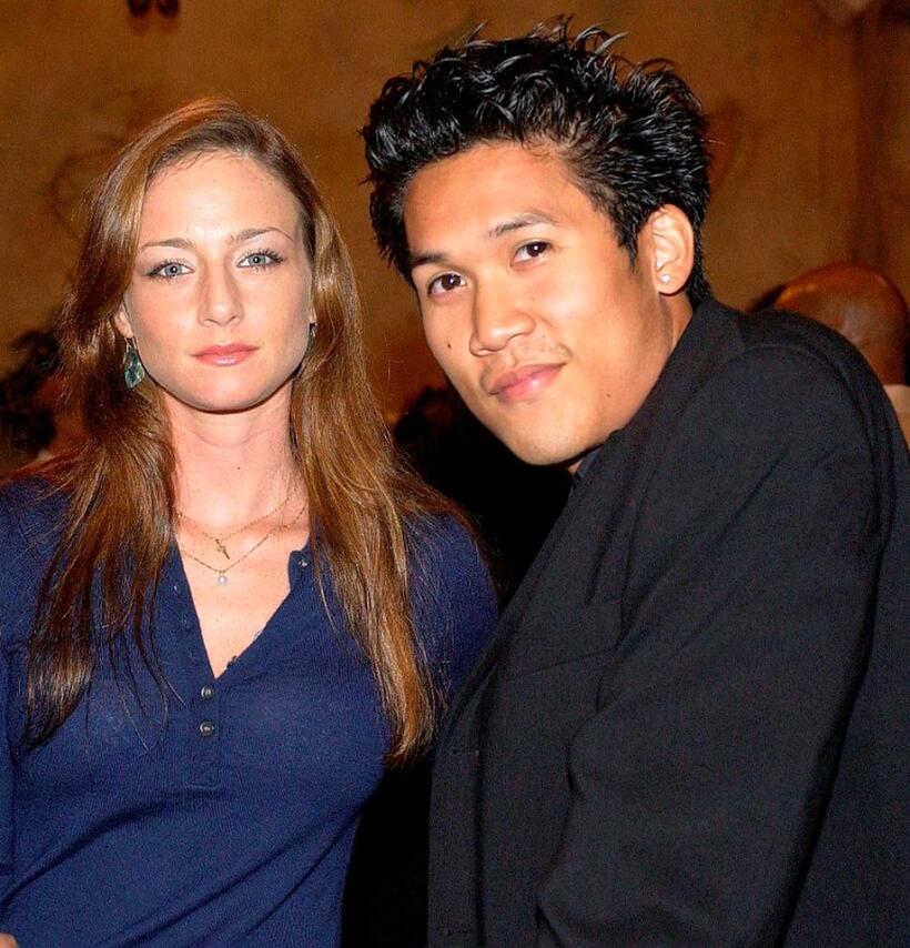 Katharine Towne and Dante Basco at the party of director John Singleton.