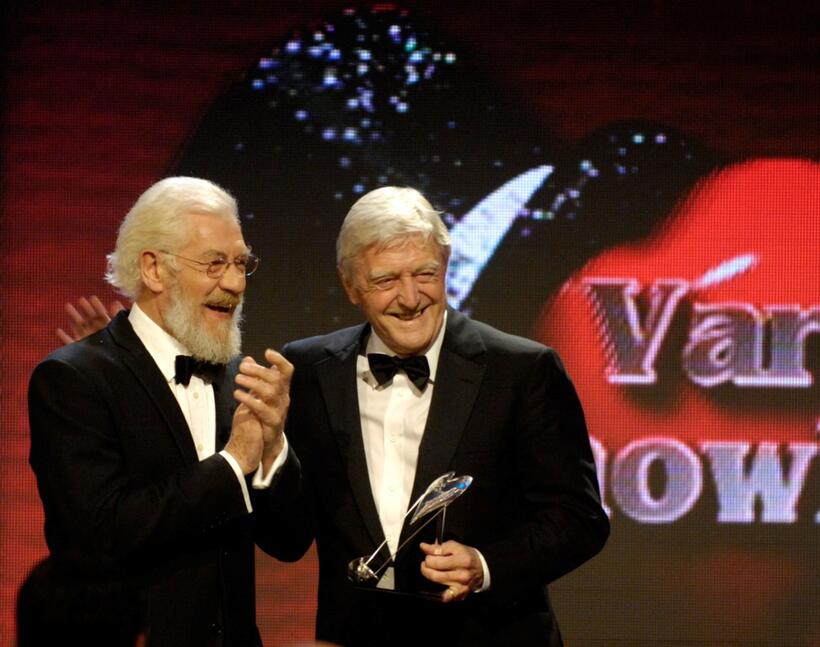 Sir Ian McKellen presents an award to Michael Parkinson at the Variety Club Showbiz Awards.