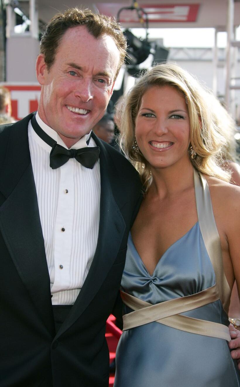 John C. McGinley and guest at the 57th Annual Emmy Awards.