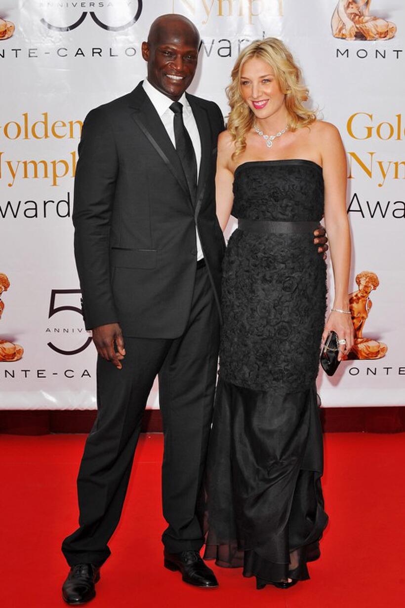Peter Mensah and Guest at the Closing Ceremony during the 2010 Monte Carlo Television Festival.