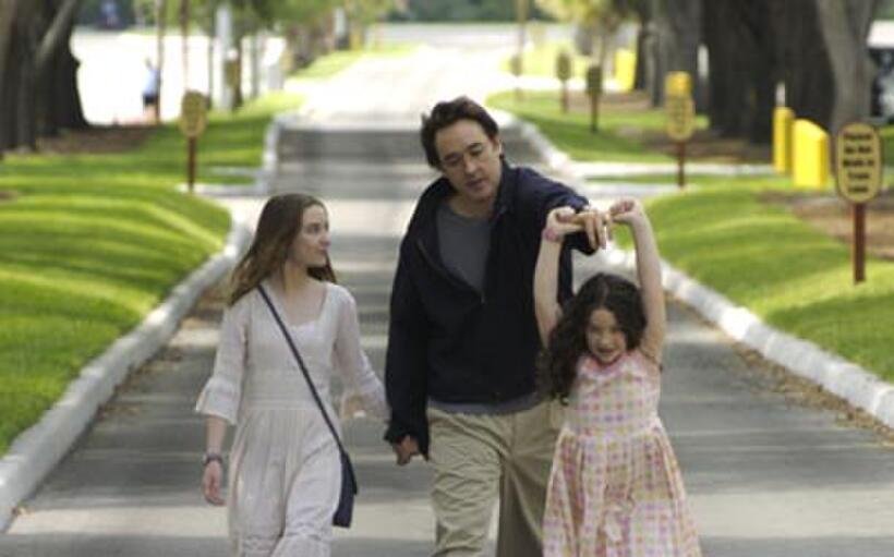 Shélan O'Keefe, John Cusack and Gracie Bednarczyk in "Grace Is Gone."