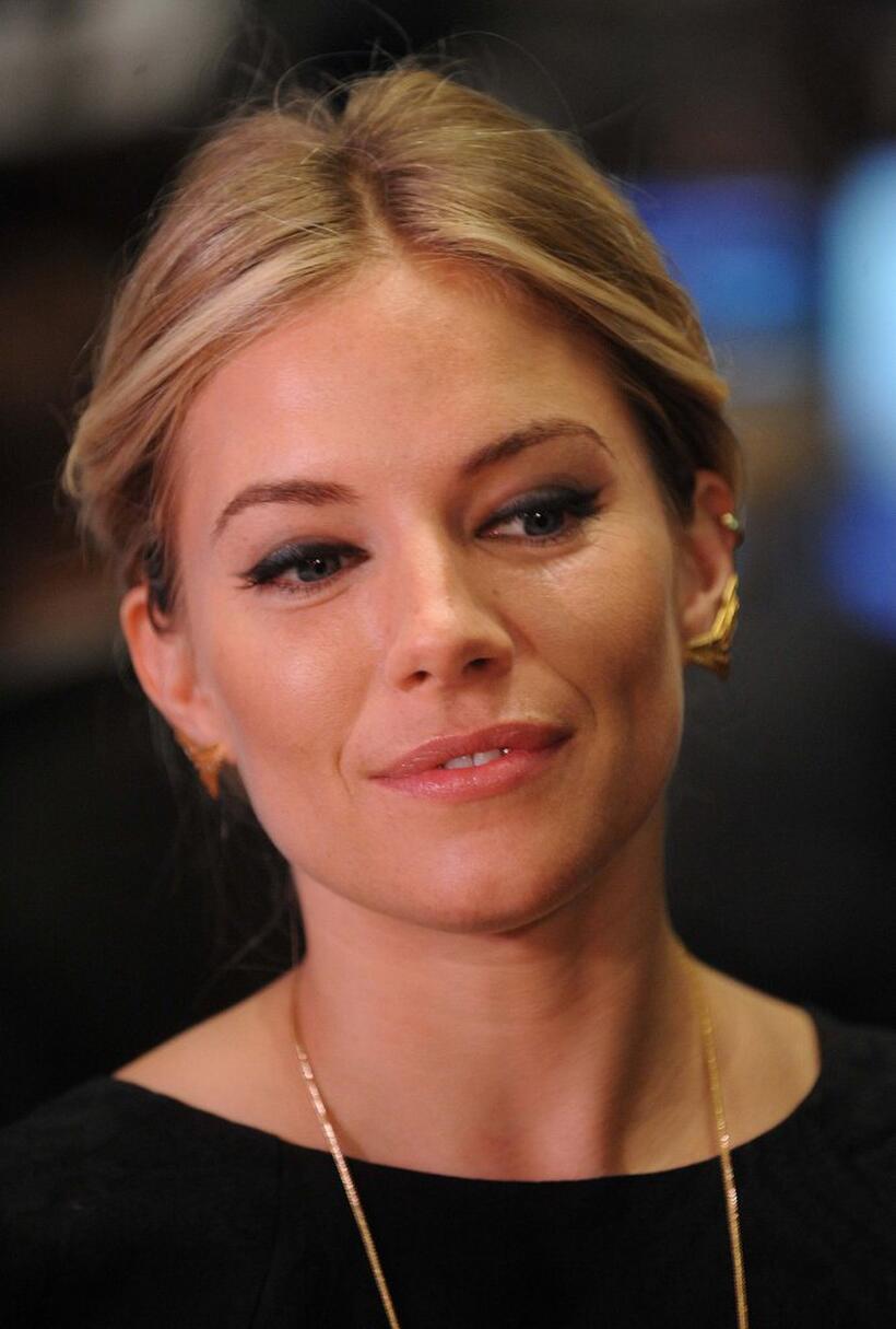 Sienna Miller at the New York Stock Exchange opening bell.